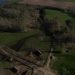 Aerial view showcasing the Biskupin archaeological site, highlighting its historic layout and rural landscape.